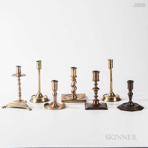 Seven Early Brass Candlesticks