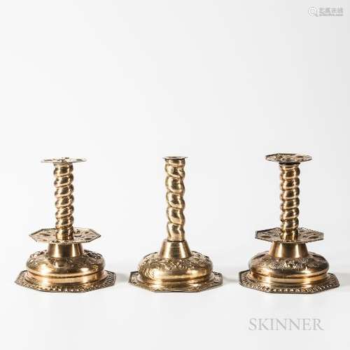 Three Dutch Brass Repousse Candlesticks