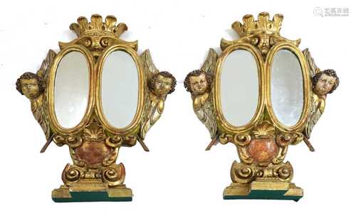 A pair of giltwood reliquary stand mirrors,