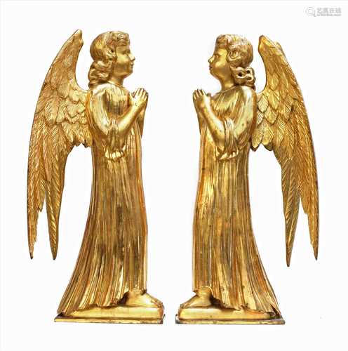 A pair of carved giltwood angels,