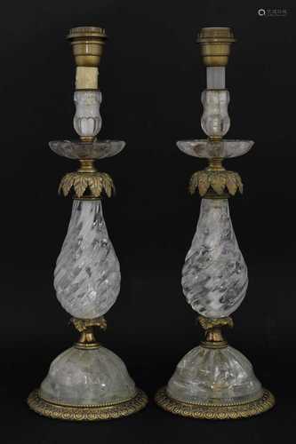 A pair of rock crystal and bronze candlesticks,