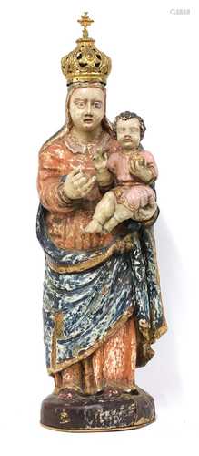 A carved wooden and polychrome painted figure of the Madonna and Child,