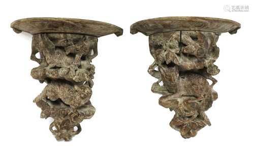 A pair of Black Forest carved wall brackets,