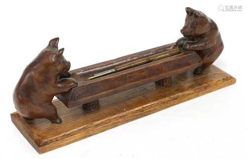 A novelty carved pen tray,