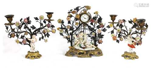 A Northern European porcelain-mounted clock garniture,