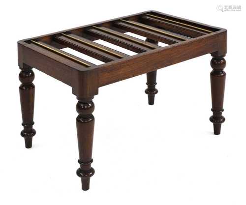 A mahogany luggage rack,