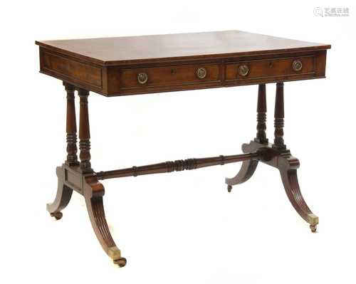 A Regency mahogany and rosewood banded library table,