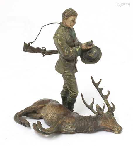 A Vienna cold painted bronze of a deerstalker standing over a dead stag,