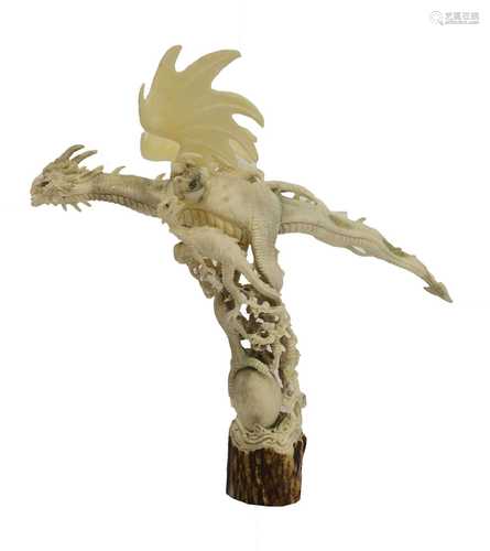 A modern finely carved antler dragon,