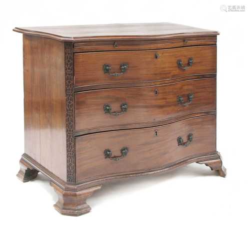 A George III mahogany serpentine commode,