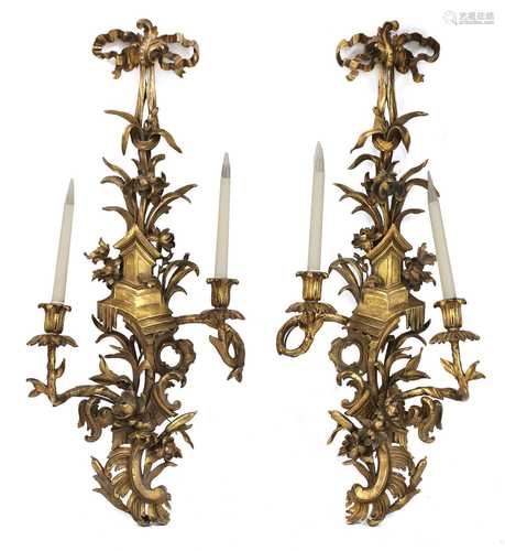 A pair of Chippendale-style carved giltwood wall sconces,