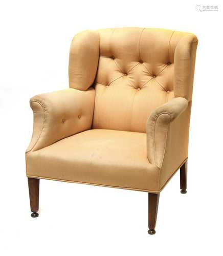 An Howard-style wingback armchair,