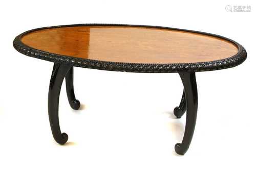 A Ceylonese ebony and satinwood oval table,