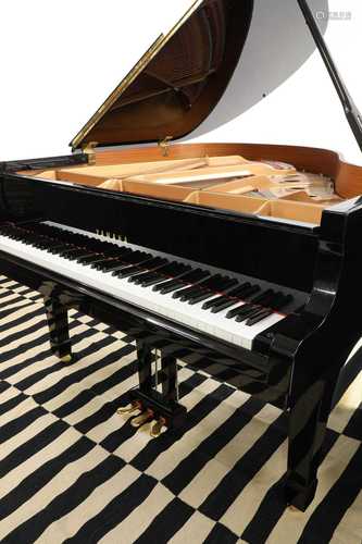 An ebonised Yamaha C1 grand piano