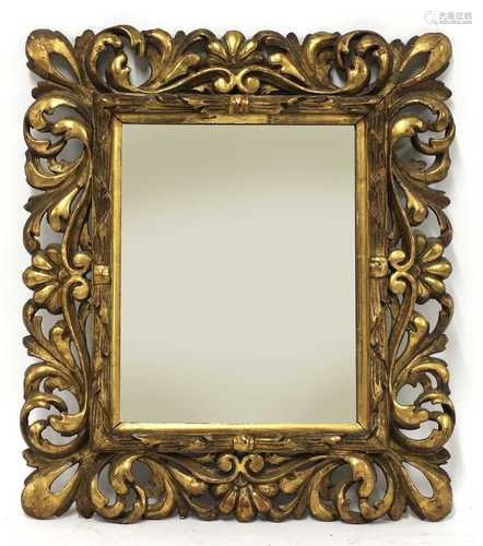 A carved giltwood wall mirror,