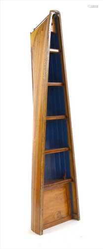 A teak free-standing shelving unit,