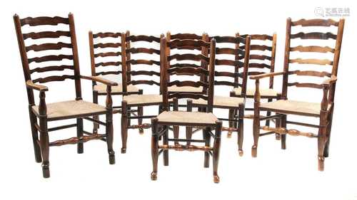 An harlequin set of eight oak and elm ladder back dining chairs,