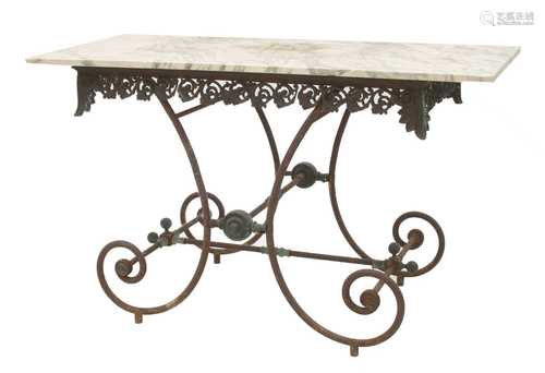 A wrought iron and brass garden or arbour table,