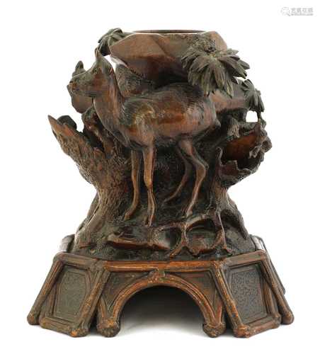 A French Black Forest-style carved wooden mantel vase,