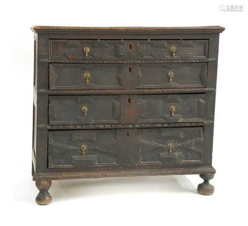 A Jacobean oak chest of four drawers,