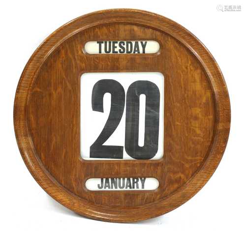 A large Edwardian oak wall-mounted perpetual calendar,