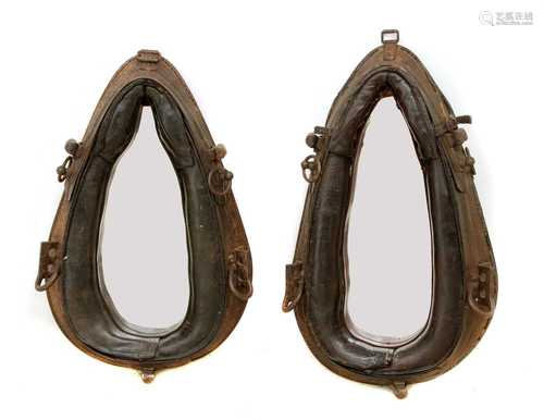 A near pair of leather harness mirrors,