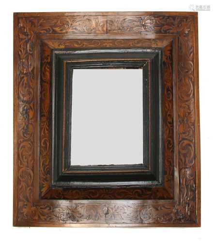 A marquetry inlaid cushion-framed mirror,