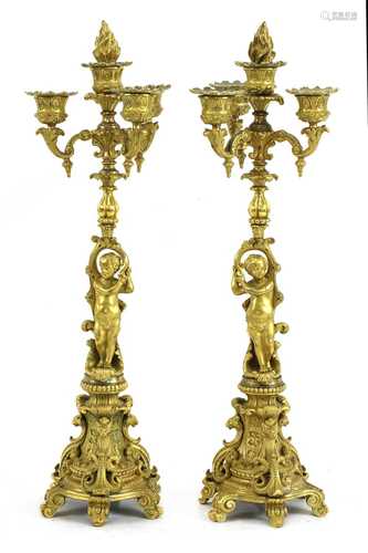 A pair of Continental ormolu four-light candelabra