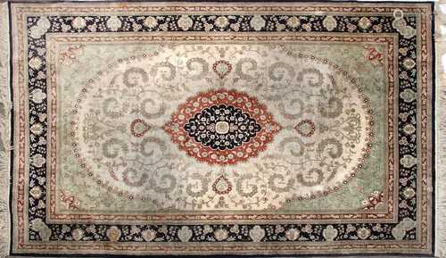 A Persian wool and silk Isfahan carpet,