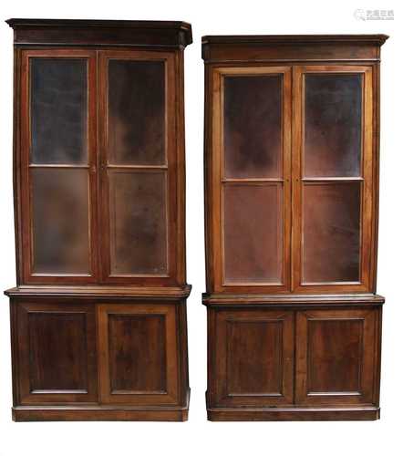 A pair of French fruitwood bookcase cabinets,