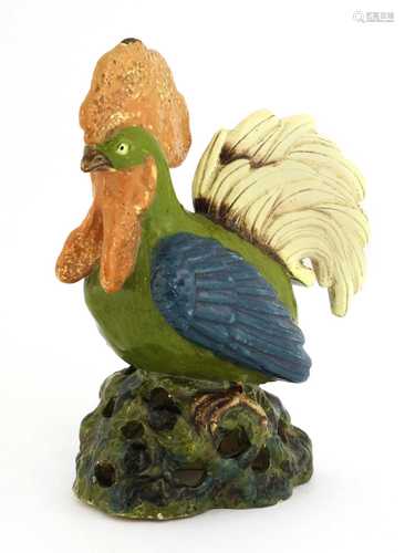 A Continental pottery cockerel,