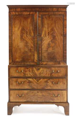 A mahogany and crossbanded linen press,