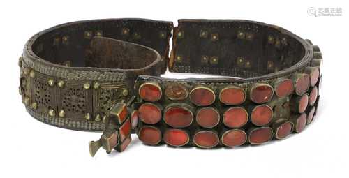 A Moghul Indian leather, brass and cornelian agate set elephant's foot collar,