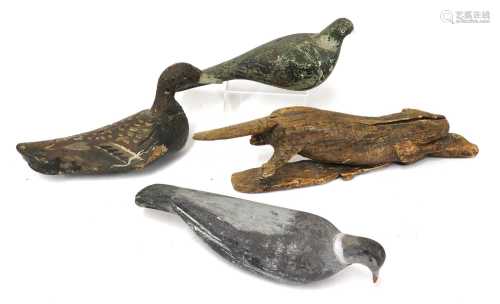 A folk carved wooden and painted decoy duck,