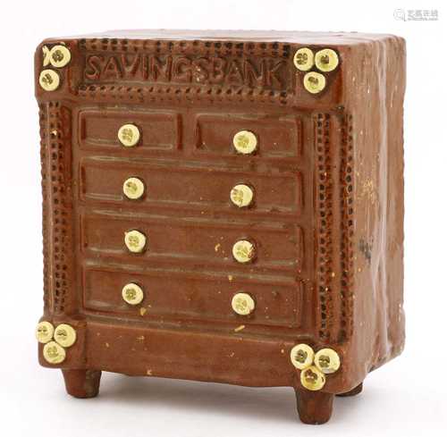 A pottery chest of drawers money bank,