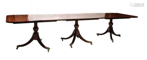 A large George III-style mahogany dining table,