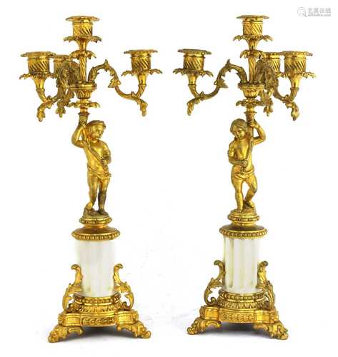 A pair of Gustavian ormolu and marble-mounted four-branch candelabra,