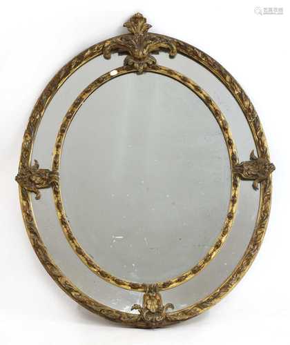 A large oval gilt wall mirror,