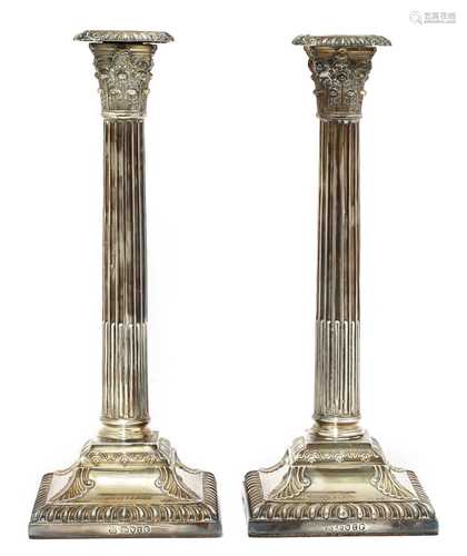 A pair of Victorian silver Corinthian column candlesticks