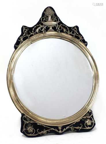 A silver dressing table mirror,