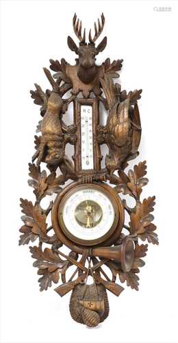 A Black Forest aneroid barometer and thermometer,