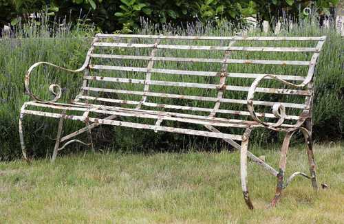 A steel three-seater garden bench,