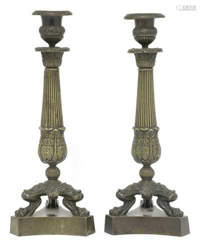 A pair of French bronze candlesticks,