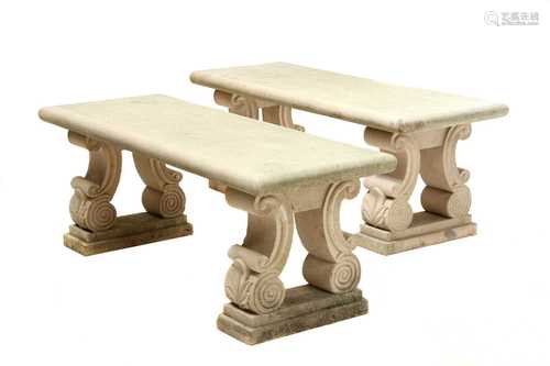 A pair of carved sandstone benches,