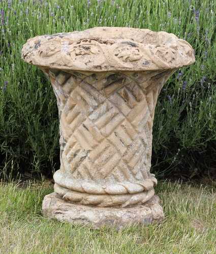 A composite stone basket weave urn,