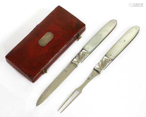 A mother-of-pearl and silver folding fruit knife and fork set,