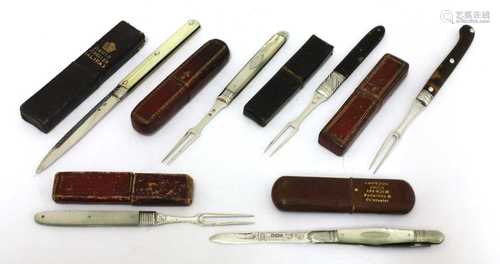 Six silver-mounted folding fruit knives and forks in cases,