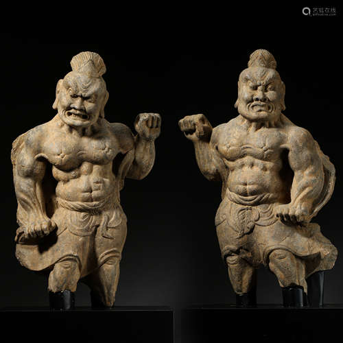 A PAIR OF ANCIENT CHINESE STONE CARVED MUSCLE MAN