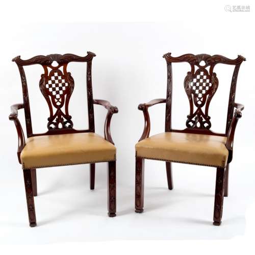 A pair of 19th Century mahogany Irish armchairs of Chinese Chippendale design with carved scrolling