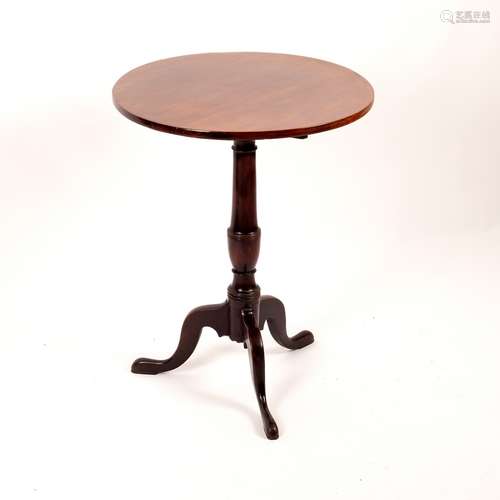 A George III mahogany lamp table, circular top on tripod base,